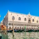 Venice, Doge's Palace and gondolas on canal.