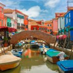 bridge near colorful houses