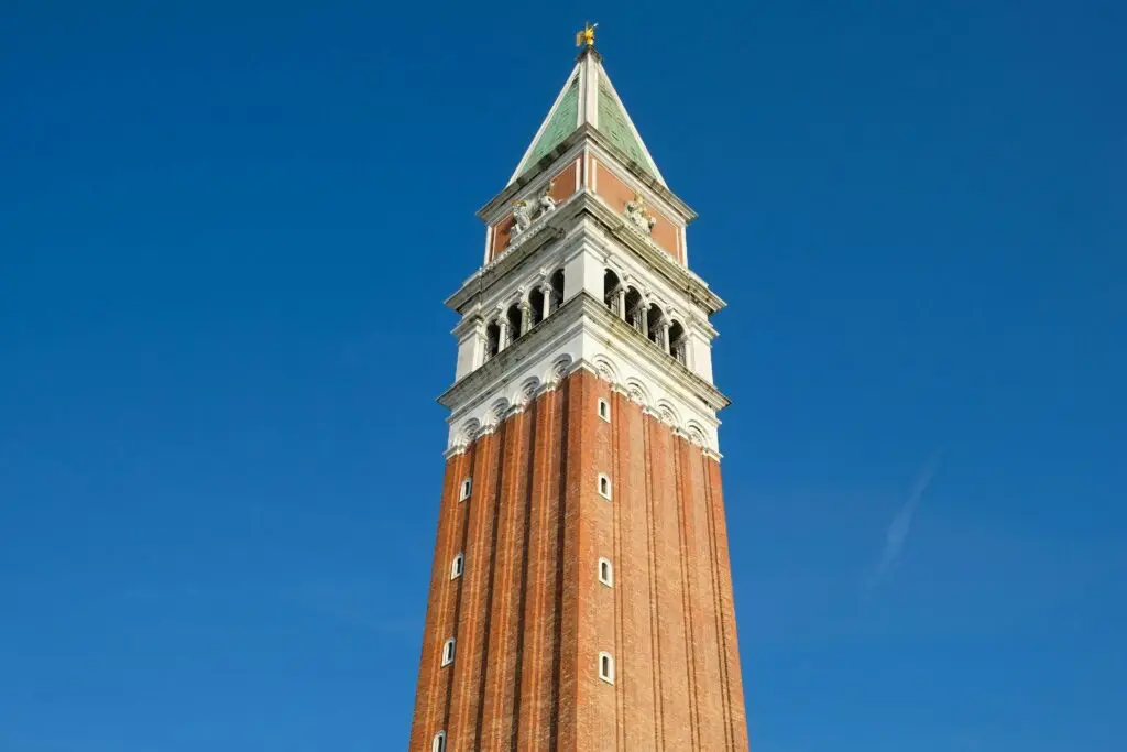 St Mark's Campanile tower against blue sky, Venice