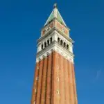 St Mark's Campanile tower against blue sky, Venice